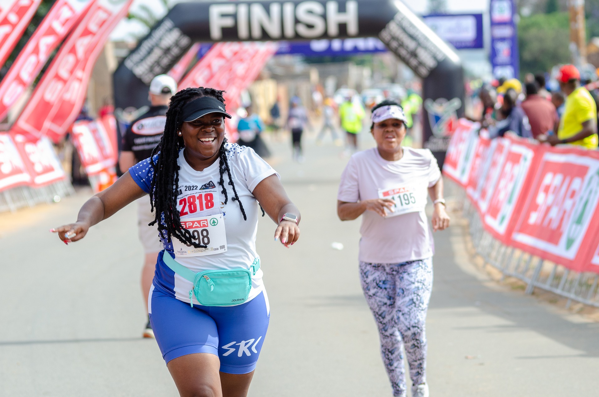 Two women running a marathon.